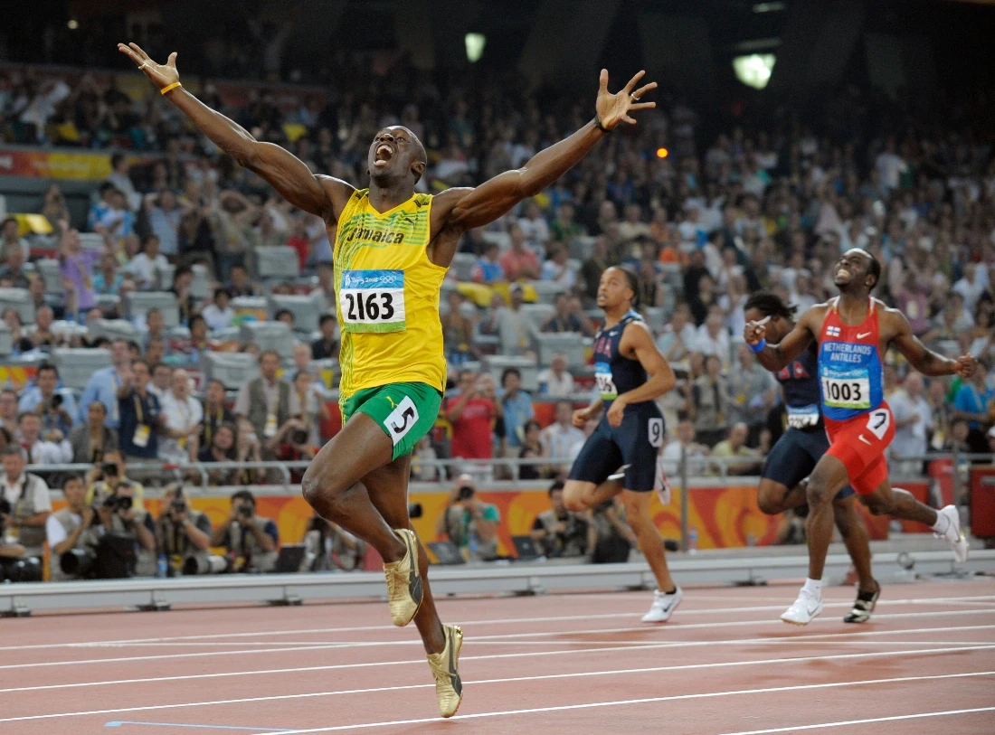 Jamaica's Usain Bolt celebrates as he wins the men's 200 meter final with a world record during the athletics competitions in the National Stadium at the Beijing 2008 Olympics in Beijing, China. (AP)