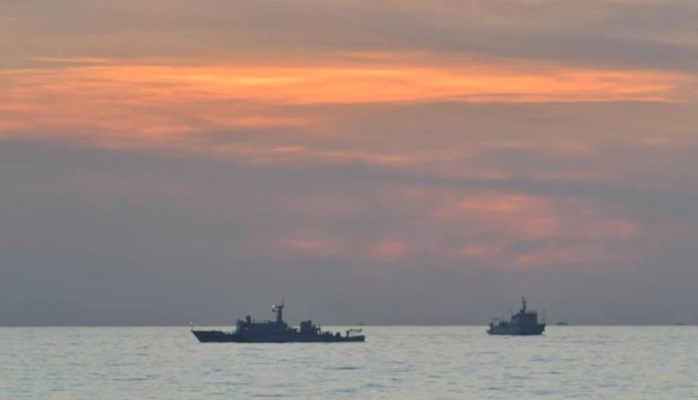 Above, Chinese surveillance ships off Scarborough Shoal in this undated photo. China earlier approved plans to turn the shoal into a national nature reserve. (DFA/PN/AFP file photo)