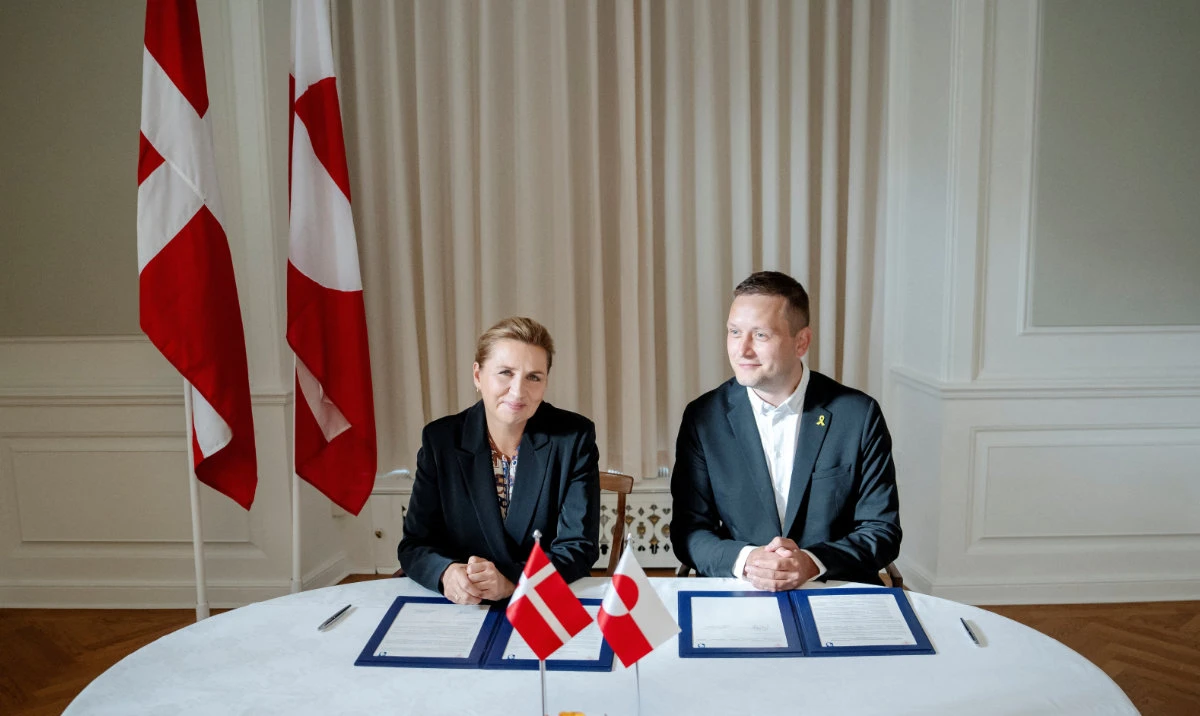 Denmark’s Prime Minister Mette Frederiksen and Greenland’s Prime Minister Jens-Frederik Nielsen sign a framework agreement for a self-sustaining Greenland at the Prime Minister’s Office in Copenhagen, Denmark, on Tuesday. (Reuters)