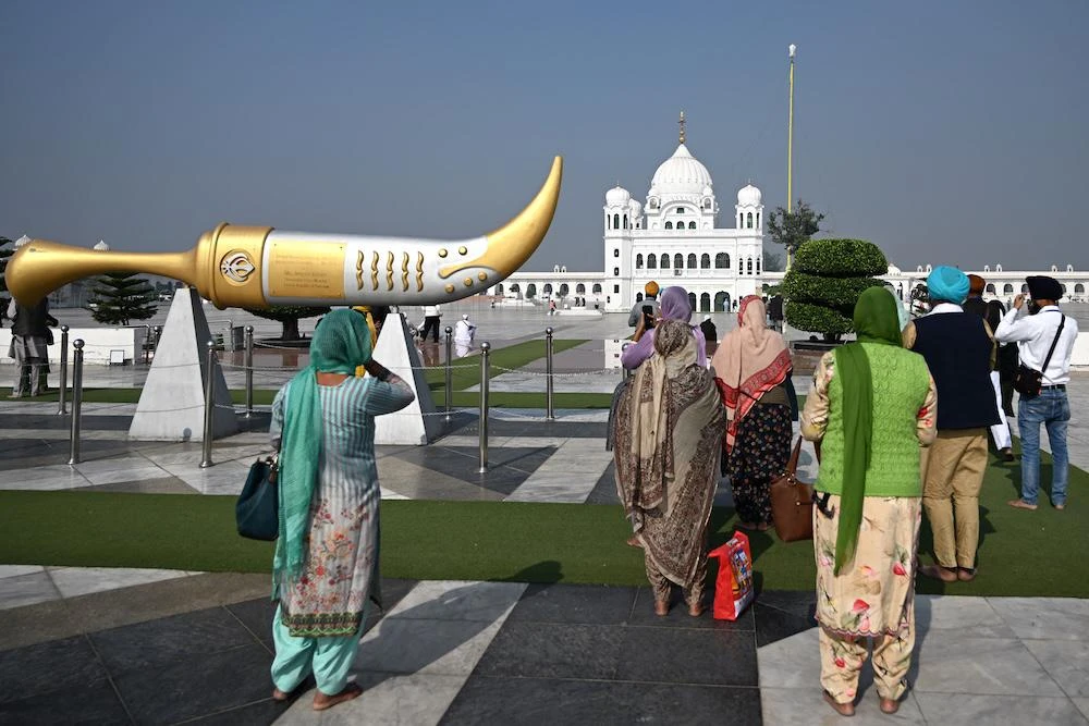 Thousands of Sikhs from India had hoped to take part in November’s weeklong celebration marking 556 years since Guru Nanak’s birth. Above, pilgrims at the Gurdwara Darbar Sahib in Kartarpur near the India-Pakistan border on Nov. 19, 2024. (AFP)