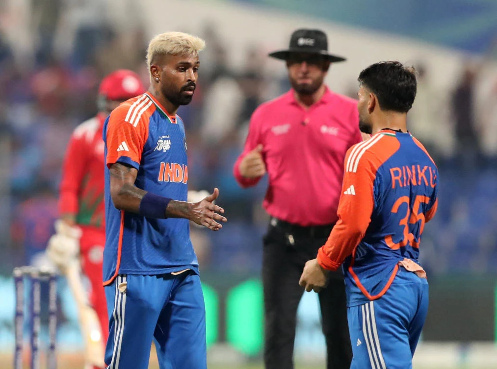 India’s Rinku Singh celebrates with Hardik Pandya after taking the catch to dismiss Oman’s Hammad Mirza off the bowling of Hardik Pandya. (Reuters)