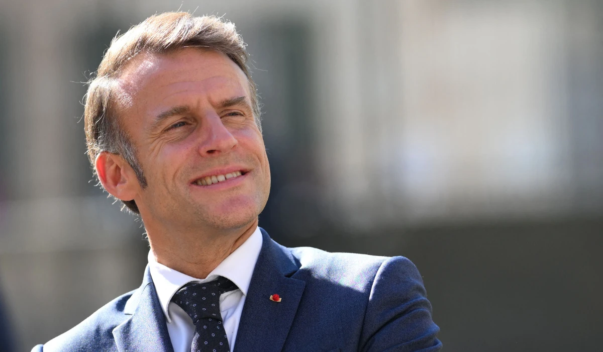 France's President Emmanuel Macron reacts during a visit to the Benedictine abbey of Pontlevoy, as part of the 42nd edition of the European Heritage Days, in Pontlevoy central France, on September 19, 2025. (AFP)