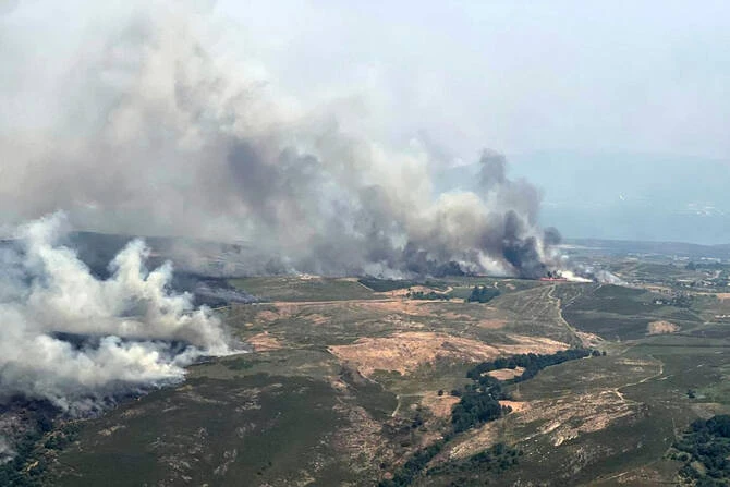 Firefighters, supported by troops, battled two wildfires on Saturday in northwestern Spain, fuelled by dry conditions and high temperatures. (AP/File)
