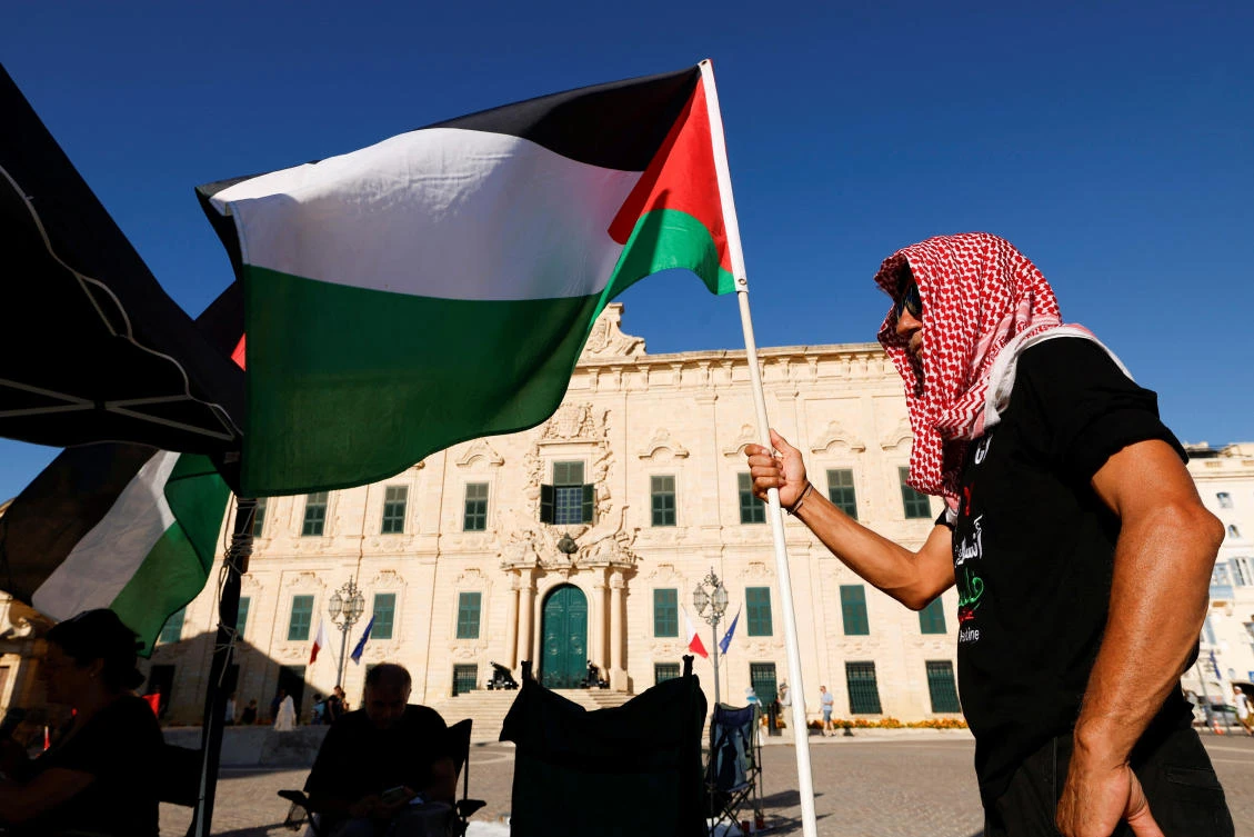 Activists hold a two-day protest vigil in solidarity with the victims in Gaza outside the Auberge de Castille in Valletta, Malta on Sept. 21, 2025. (Reuters)