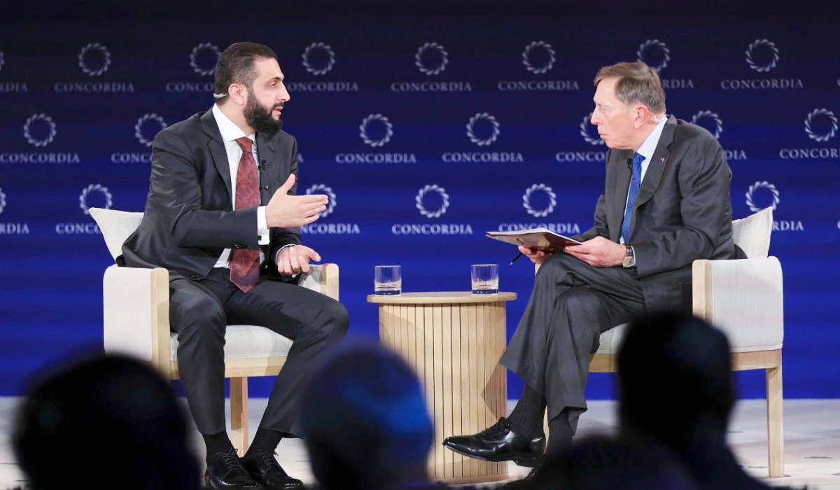 Syria's interim President Ahmad Al-Sharaa, left, meets with David Petraeus, former director of the CIA and retried US military general during the Concordia Annual Summit in New York, Monday, Sept. 22, 2025. (AP)