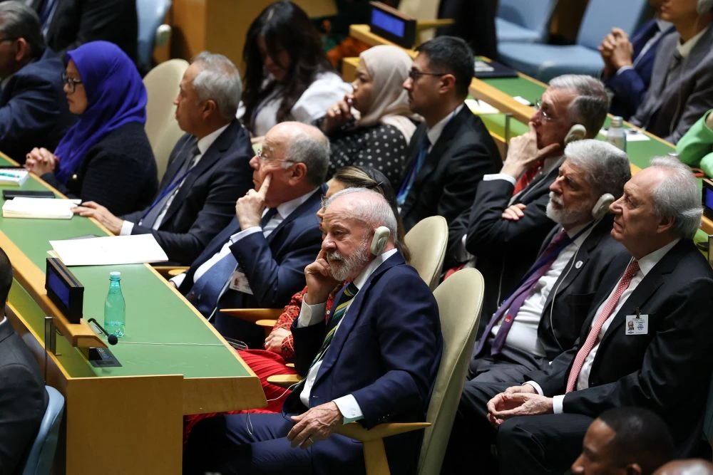 Brazil’s President Luiz Inacio Lula da Silva listens as US President Donald Trump addresses the United Nations General Assembly at UN headquarters, in New York City, on September 23, 2025. (AFP)