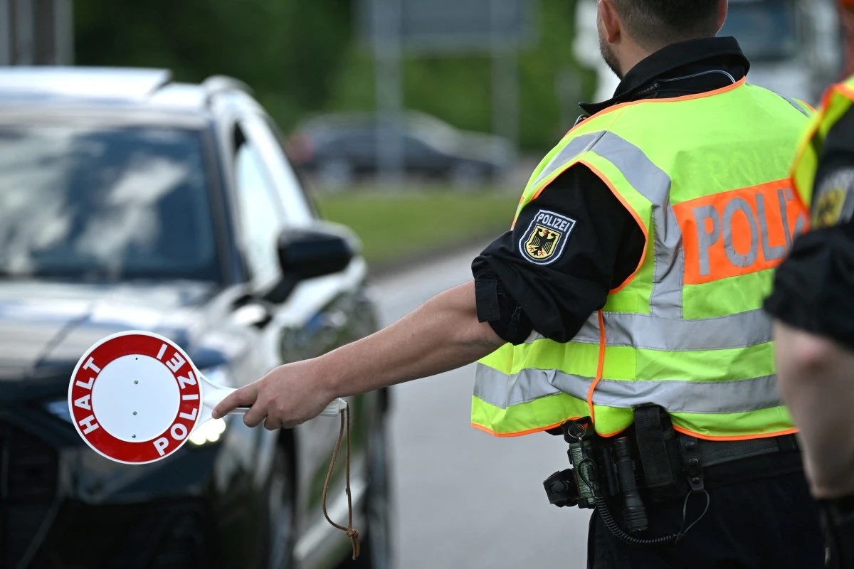 A German police officers conduct an inspection of vehicles at a border control station with the Netherlands, near western Germany, May 8, 2025. (AFP)