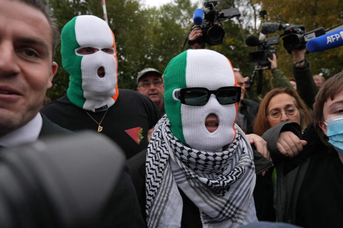 A British court throws out a terror-related charge against a member of the Irish rap group Kneecap