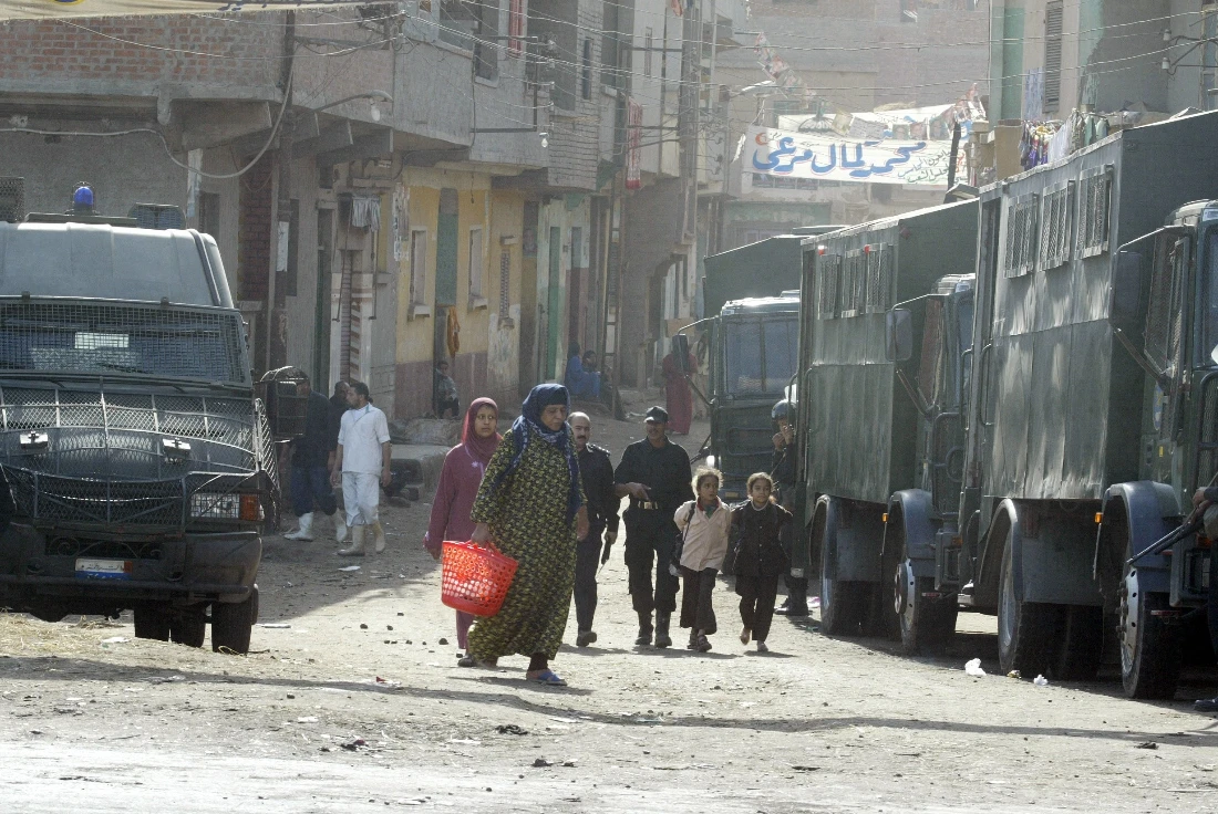 Egyptian riot police vehicles secure the gate of el-Dwakhliya village in the Nile Delta al-Mahalla governorate in 2005. (AFP)