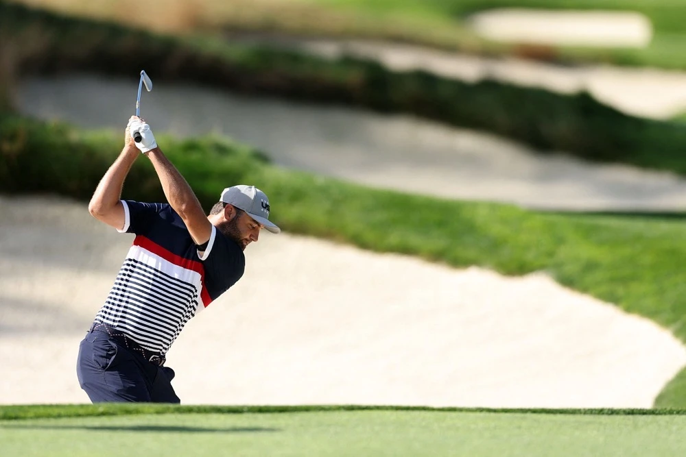 Scottie Scheffler of Team United States plays his shot from the thirteenth fairway bunker. (Getty Images/AFP)