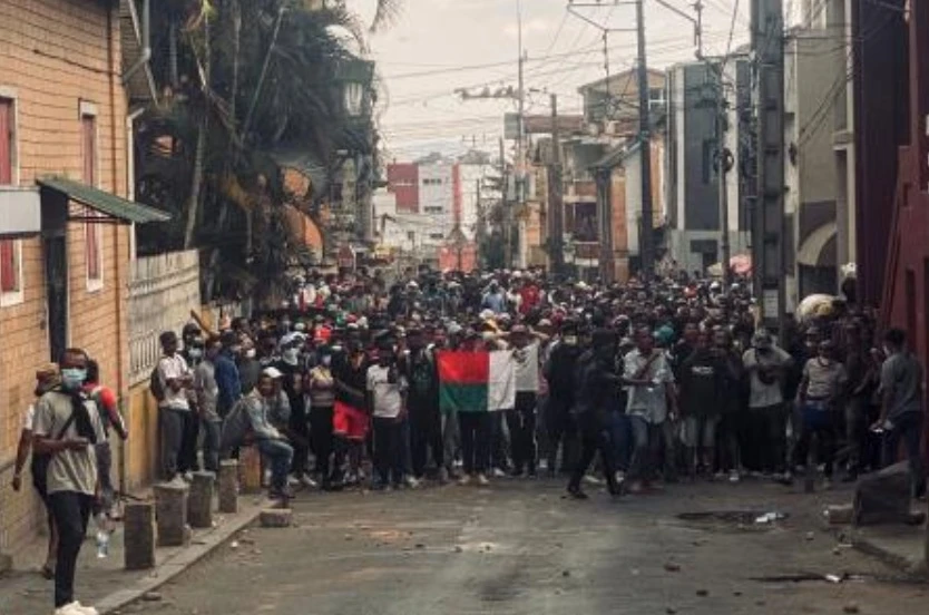 Protesters holding a Madagascar flag gather during a demonstration against repeated water and electricity outages in Antananarivo on Sept. 30, 2025. (AFP)