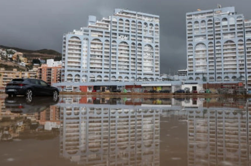 A parked car is surrounded by water following heavy rains during the passage of post-tropical Cyclone Gabrielle in Cullera, Valencia region, Spain, Sept. 30, 2025. (Reuters)