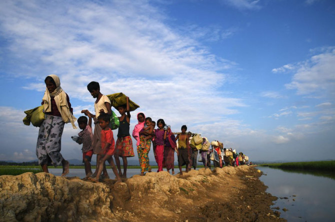 Rohingya refugees walk towards the Balukhali refugee camp in Bangladesh after fleeing from Myanmar. (AFP/File)