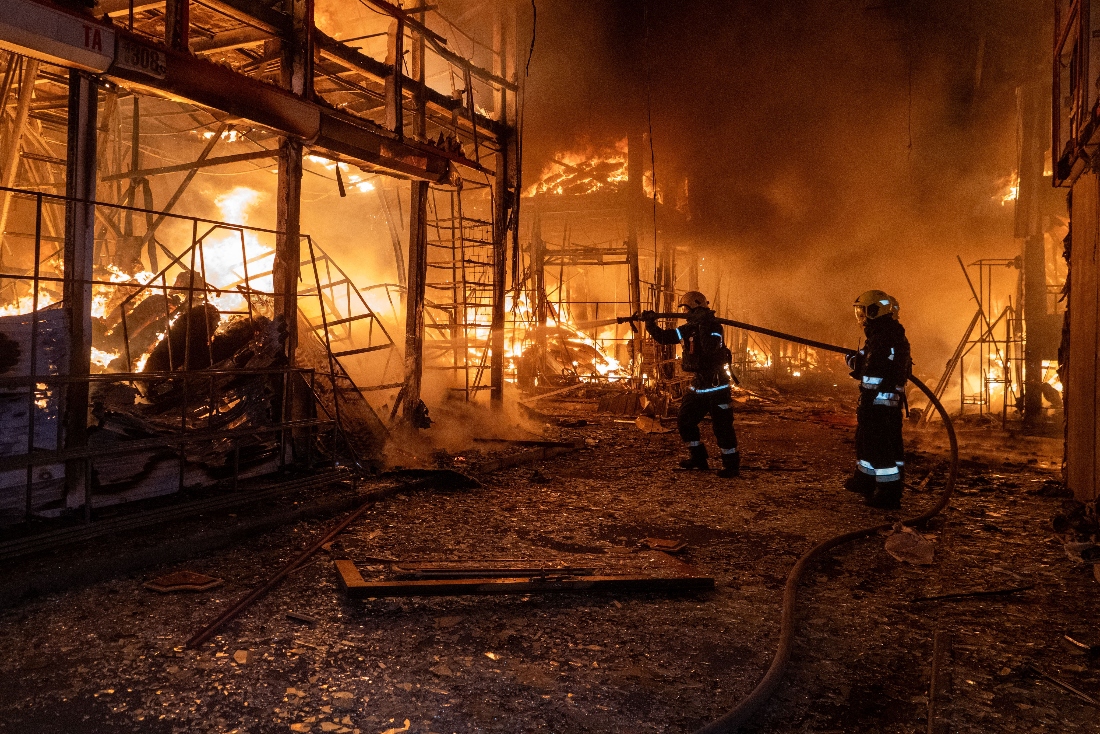 Firefighters tackle the blaze after a Russian air attack that hit at Barabashovo market in Kharkiv, Ukraine. (AP)