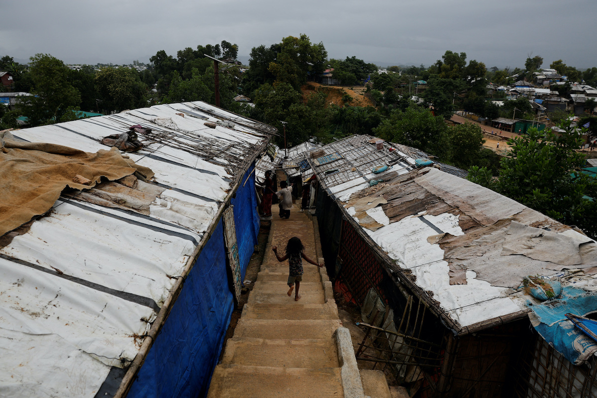 A Rohingya refugee child runs down the stairs of a refugee camp in Cox's Bazar, Bangladesh. (Reuters/File)