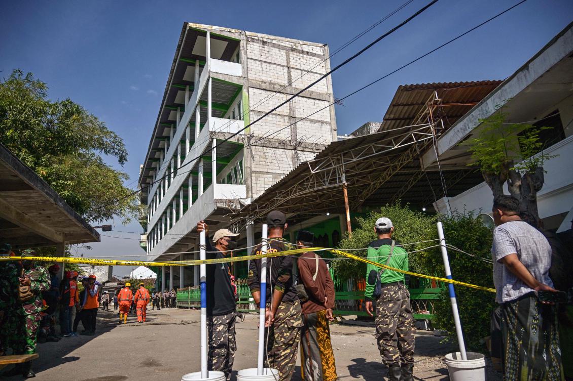 Above, the cordoned off area at the Al-Khoziny Islamic boarding school in Sidoarjo, East Java province on Oct. 2, 2025, after a multi-story building at the school collapsed. (AFP)