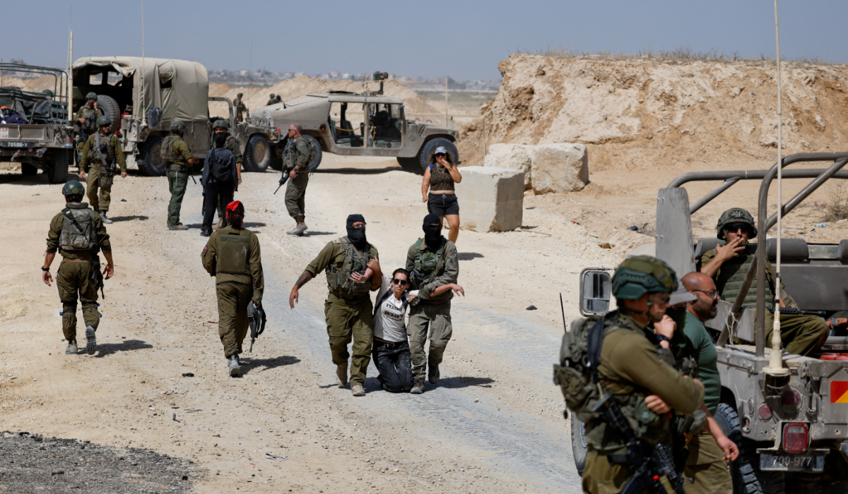 A demonstrator is detained during a protest against Israel's interception of the Global Sumud Flotilla which was carrying aid for Gaza, on the border in southern Israel, October 3, 2025. (REUTERS)
