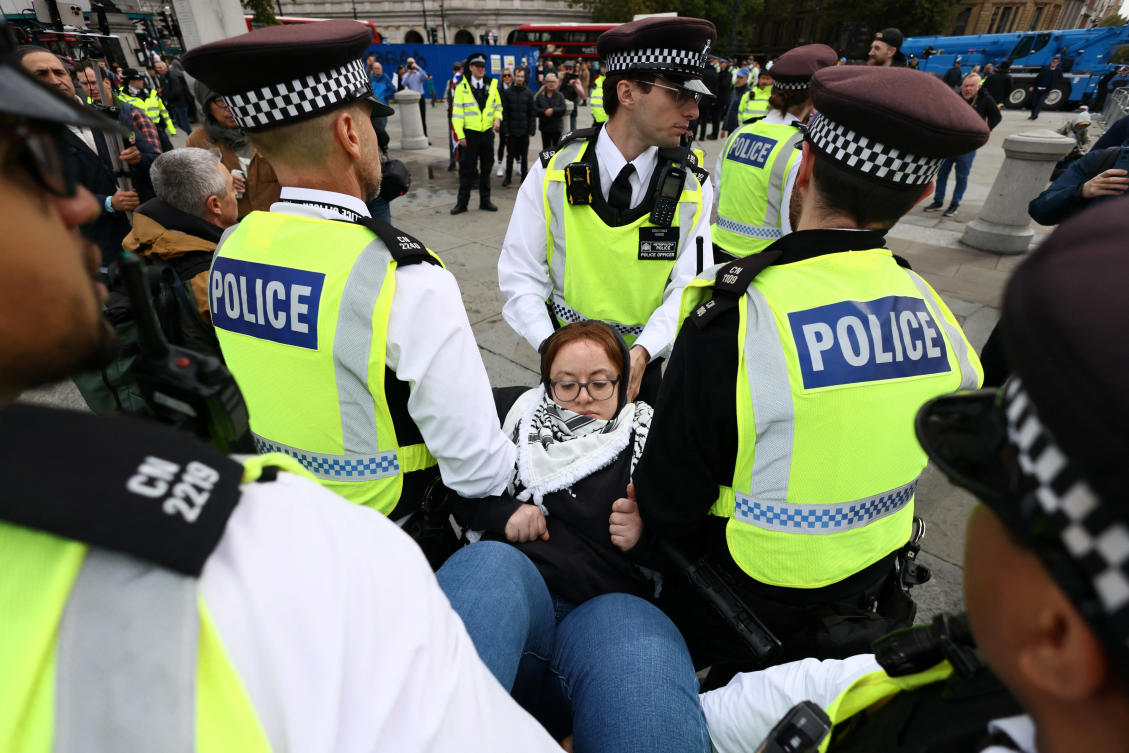 Police officers detain a protester during a mass demonstration organized by Defend our Juries, against the British government’s ban on Palestine Action in London, Britain, October 4, 2025. (Reuters)