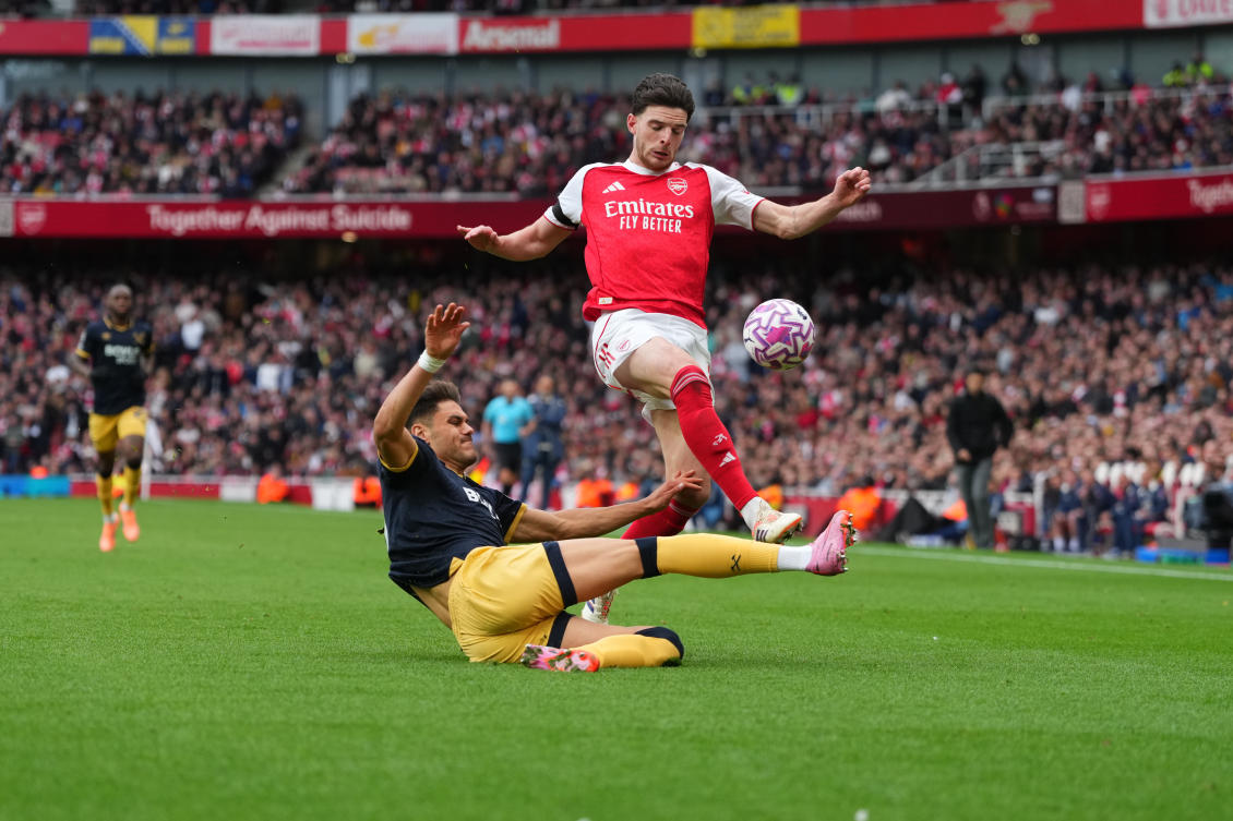 Arsenal’s Declan Rice, right, and West Ham’s Konstantinos Mavropanos challenge for the ball during the English Premier League soccer match between Arsenal and West Ham United at the Emirates stadium in London, Saturday, Oct. 4, 2025. (AP)