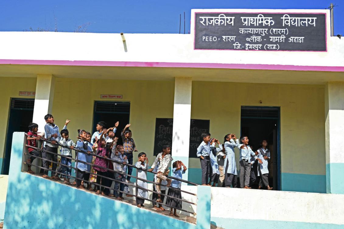 In this photograph taken on April 8, 2025, students gather outside their classrooms of a government primary school at Kalyanpur village in India's Rajasthan state. (AFP)