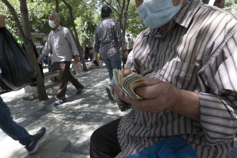 The rial has hit repeated record lows in recent days, according to black market trackers, amid the reimposition of United Nations sanctions on Iran. (AFP)
