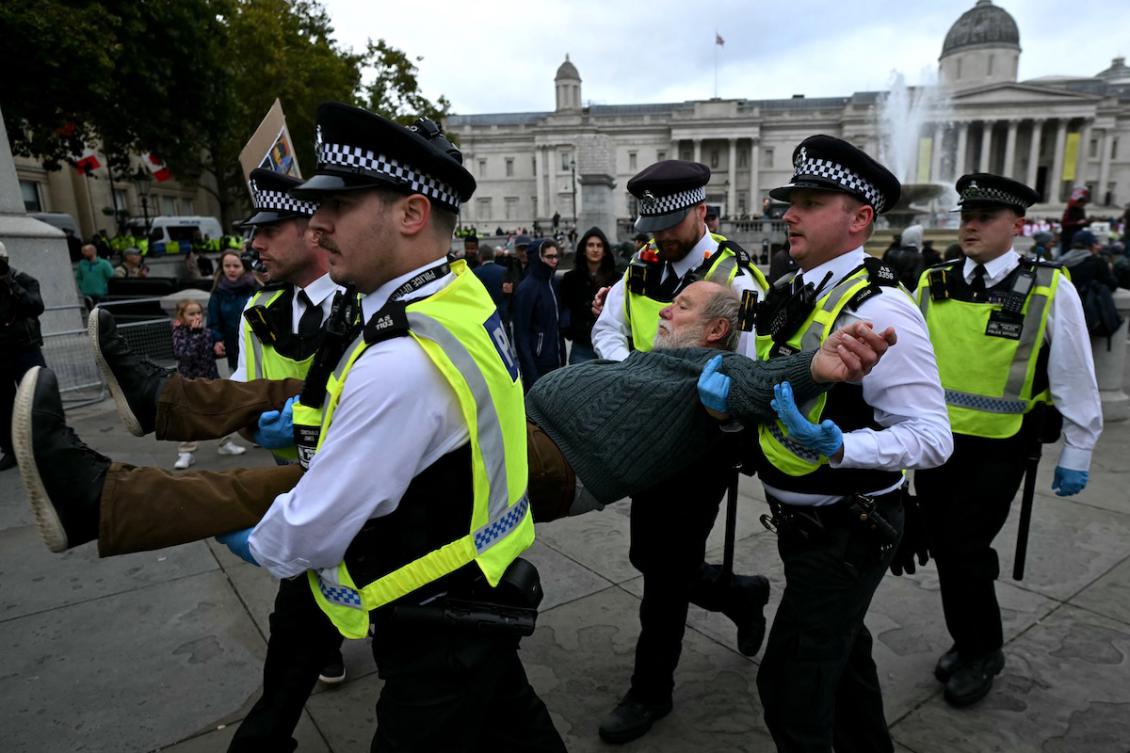 A protester is taken away by police officers at a "Lift The Ban" demonstration in support of the proscribed group Palestine Action, calling for the recently imposed ban to be lifted, in Trafalgar Square, central London, on October 4, 2025. (FILE/AFP)