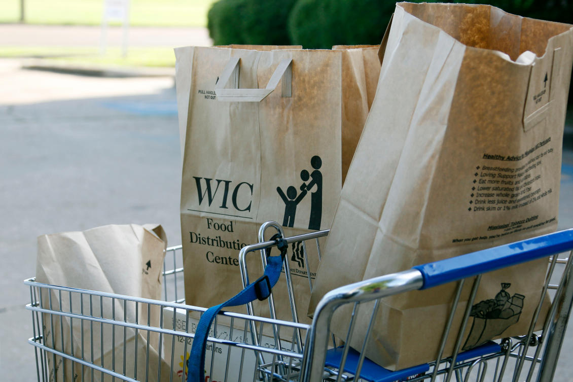 Grocery bags with food from the Special Supplemental Nutrition Program for Women, Infants and Children, WIC, sit in a shopping cart before being loaded into a vehicle in Jackson, Miss., Oct. 3, 2013. (AP)