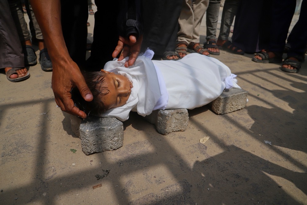The body of 5-year-old Jamal Al-Najjar is placed on a pedestal of bricks before his funeral prayer. (AP/File)