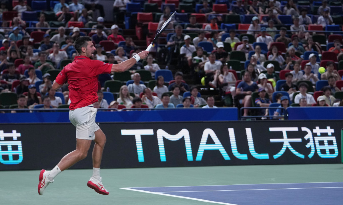 Novak Djokovic, of Serbia returns a forehand shot from Jaume Munar, of Spain during the men's singles match of the Shanghai Masters tennis tournament at Qizhong Forest Sports City Tennis Center, in Shanghai, China, Tuesday, Oct. 7, 2025. (AP)