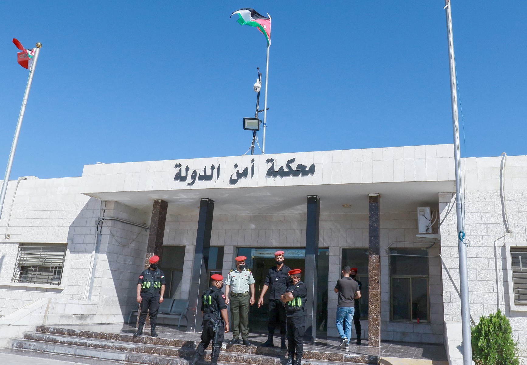 Officers stand guard outside Jordan's State Security Court. (File/AFP)