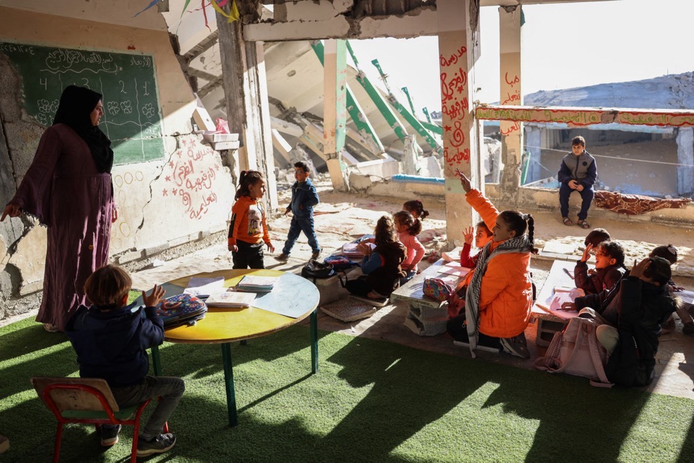Yet amid the devastation, Gaza’s children continue to cling to whatever schooling they can get. (AFP)