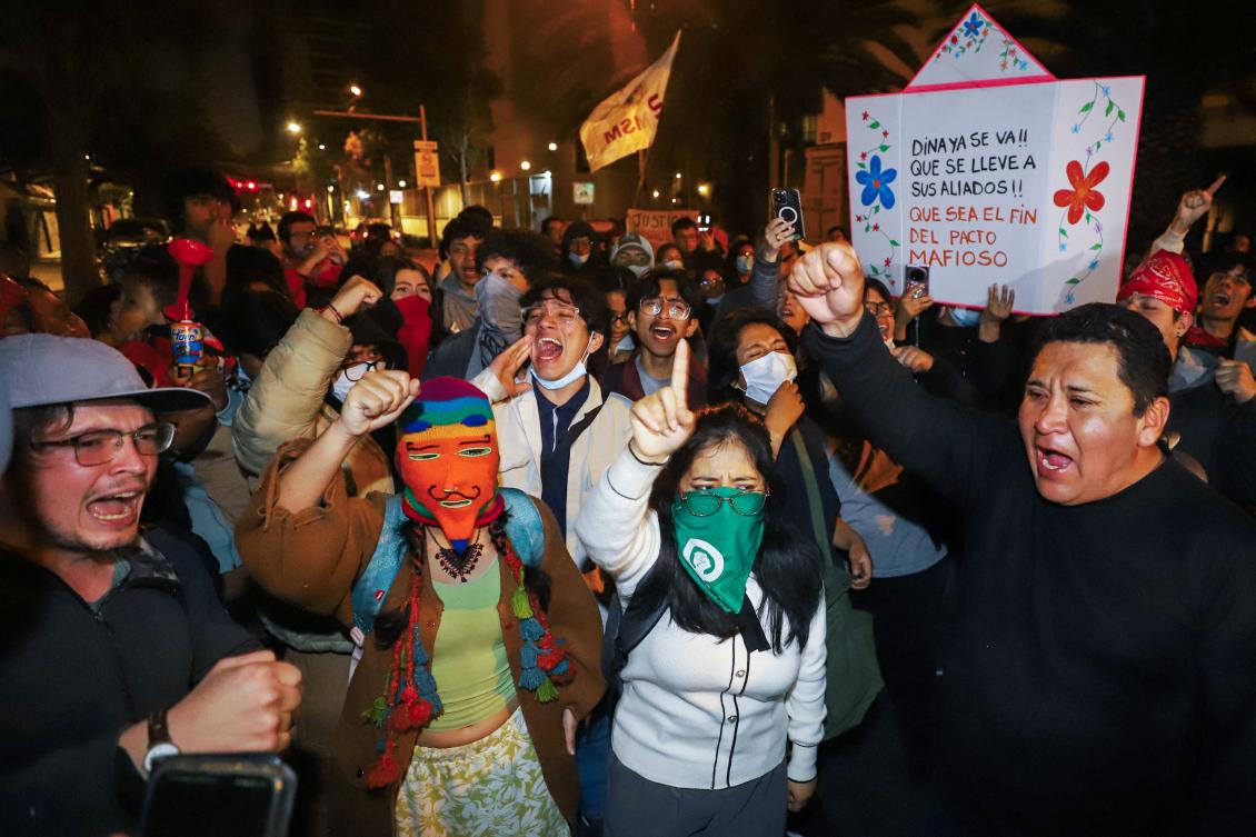 Demonstrators take part in a protest against former President Dina Boluarte after the congress approved four motions of impeachment against the former preuvian president in Lima on October 9, 2025. Lawmakers in Peru voted Friday to remove president Dina Boluarte, whose term has been marked by protests and accusations of failing to stem crime. (Photo by Jorge CERDAN / AFP)