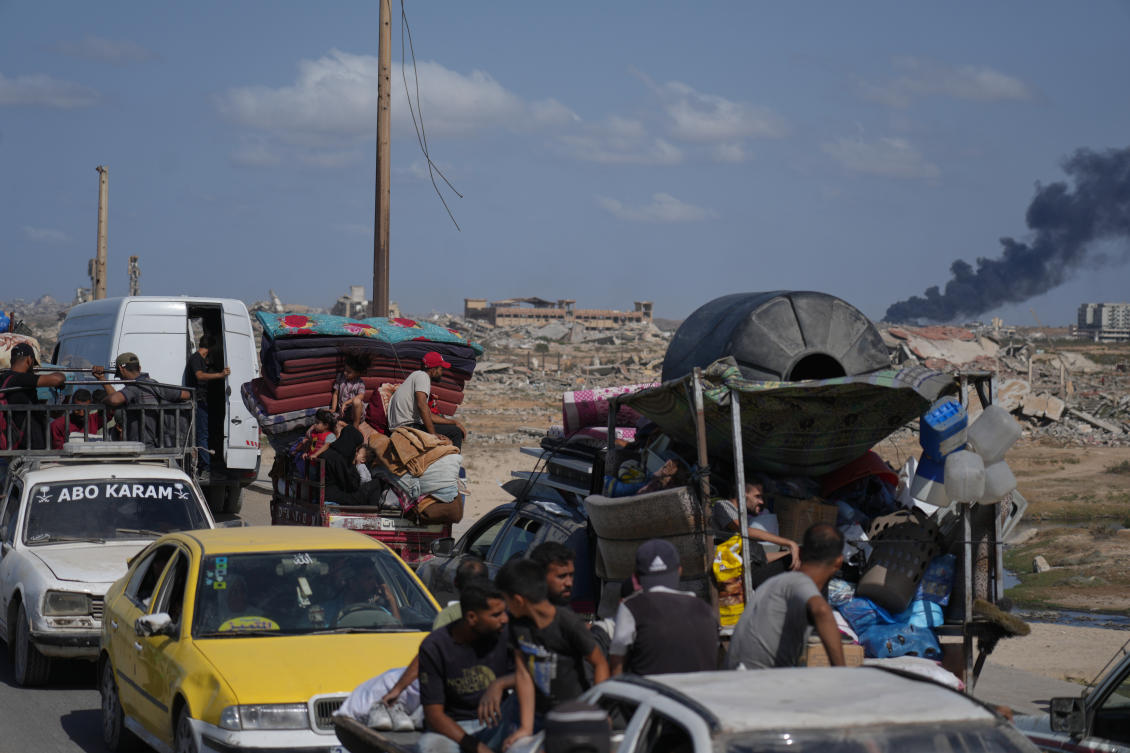 Displaced Palestinians ride on vehicles loaded with belongings as they travel along the coastal road near Wadi Gaza in the central Gaza Strip, moving toward Gaza City, Oct. 11, 2025, after Israel and Hamas agreed to a pause in their war and the release of the remaining hostages. (AP)