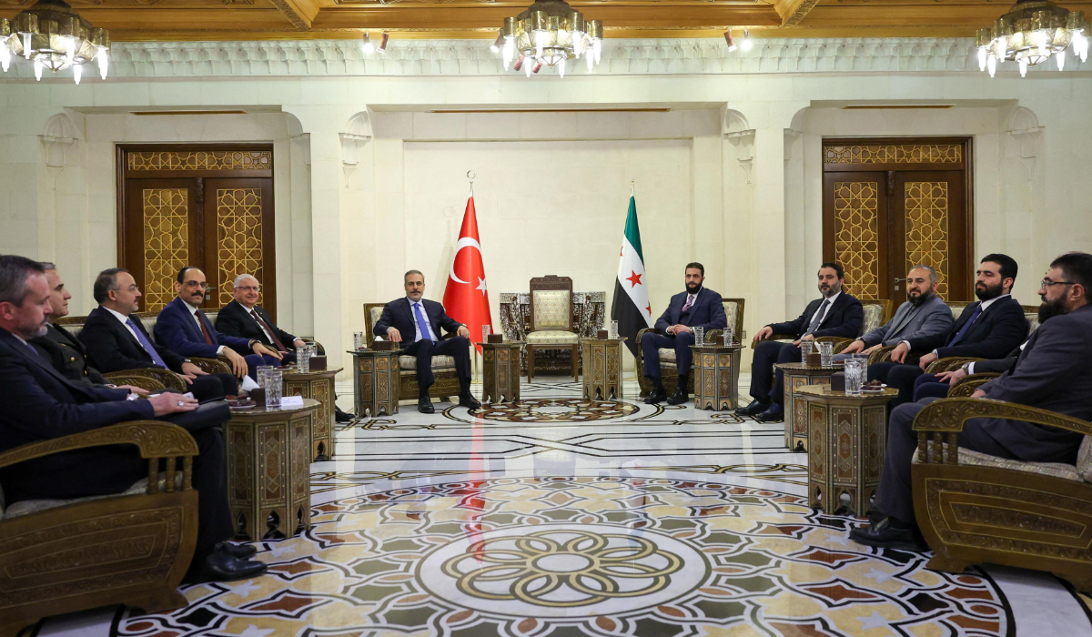 This handout picture released by the Turkish Foreign Ministry press service shows Turkey's Foreign Minister Hakan Fidan (centre-L) meeting with Syria's interim President Ahmed al-Sharaa in Damascus on March 13, 2025. (AFP)
