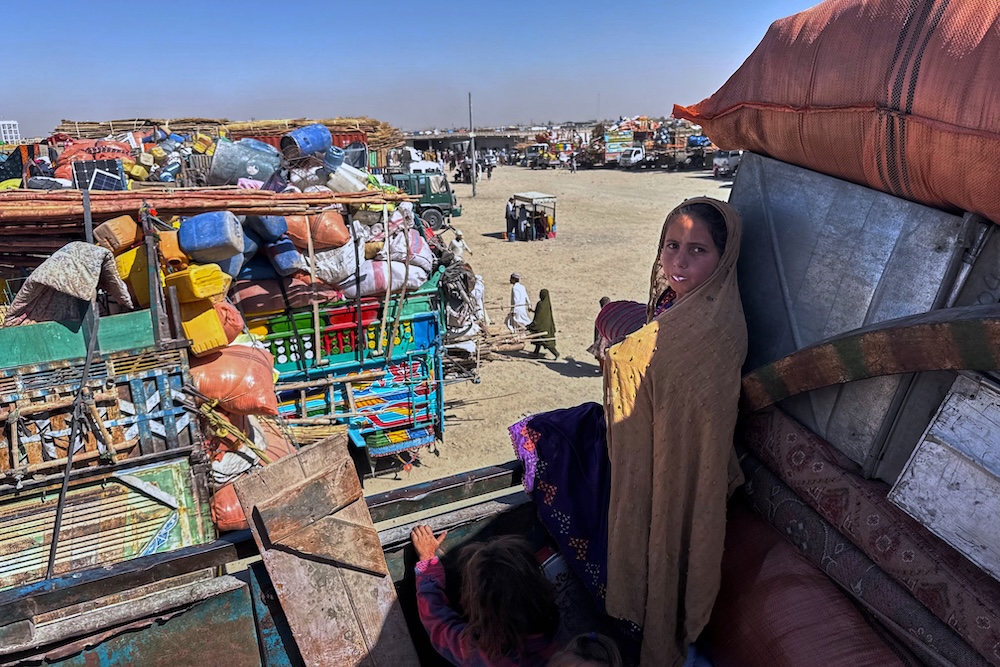 Above, Afghan refugees wait for the opening of the border crossing point, which closed following Afghan and Pakistani security forces exchanged cross border firing, at a camp in Chaman, Pakistan, on Oct. 12, 2025. (AP)