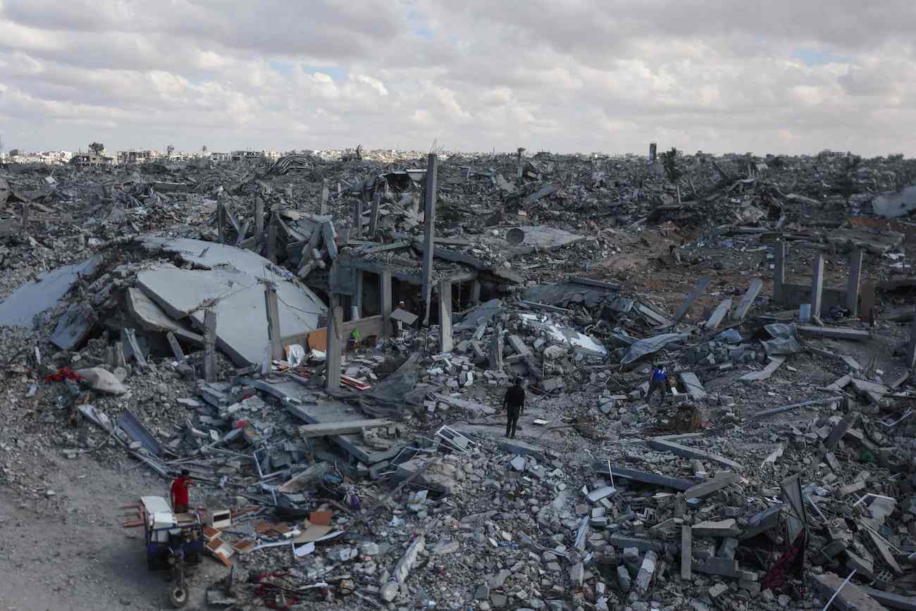 Palestinians search the rubble of buildings amid widespread destruction due to Israeli bombardment in Khan Yunis in the southern Gaza Strip, as a ceasefire holds on October 12, 2025. (AFP)