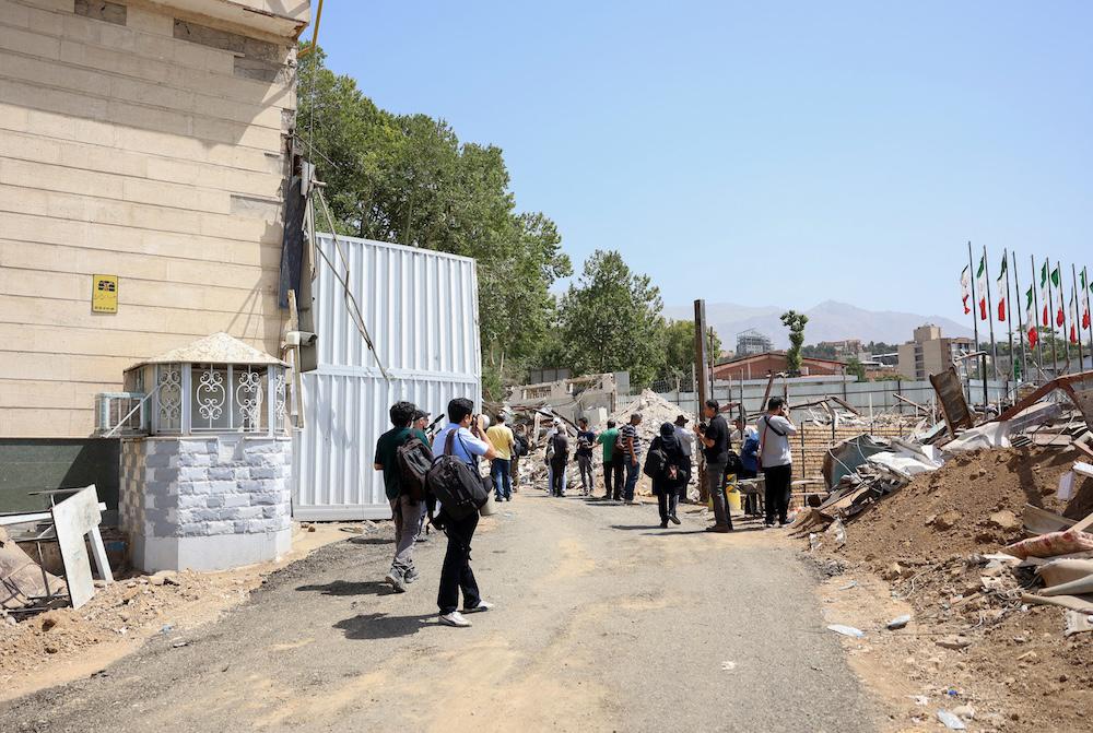 Above, the gate of Evin prison in Tehran on July 1, 2025 after being hit by Israeli air strikes. (AFP)