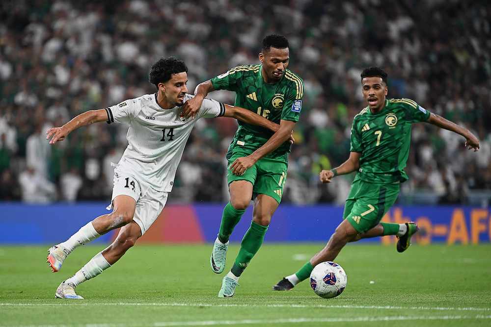 Iraq’s Zidane Aamar Iqbal, left, is challenged by Saudi Arabia’s Aiman Yahya, center, and Saudi Arabia’s Musab Aljuwayr during the World Cup 2026 Asian qualifier fourth-round Group B soccer match between Saudi Arabia and Iraq at Alinma Bank Stadium in King Abdullah Sports City in Jeddah. (AP)