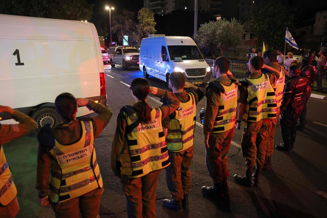 Vehicles transporting the bodies of four hostages arrive at the National Center for Forensic Medicine in Tel Aviv on Oct. 15, 2025. (AFP)