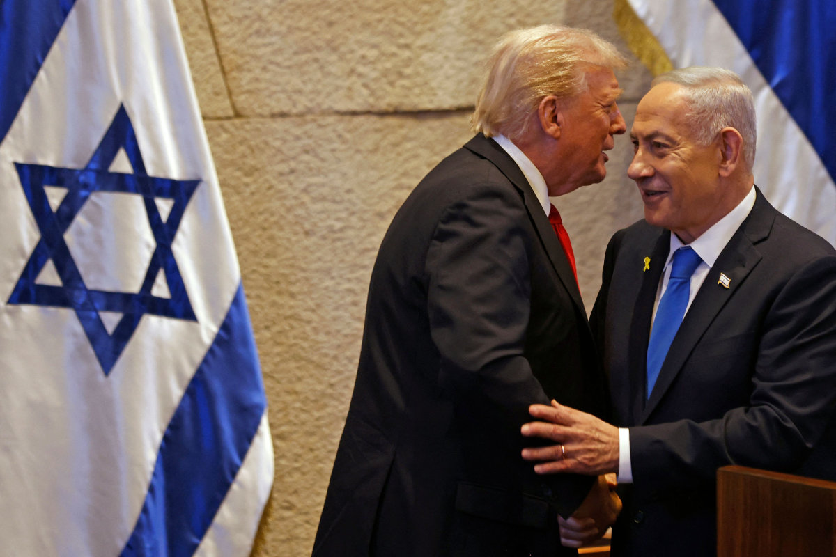 US President Donald Trump (L) speaks with Israel's Prime Minister Benjamin Netanyahu at the Israeli parliament, the Knesset, in Jerusalem on October 13, 2025. (AFP)
