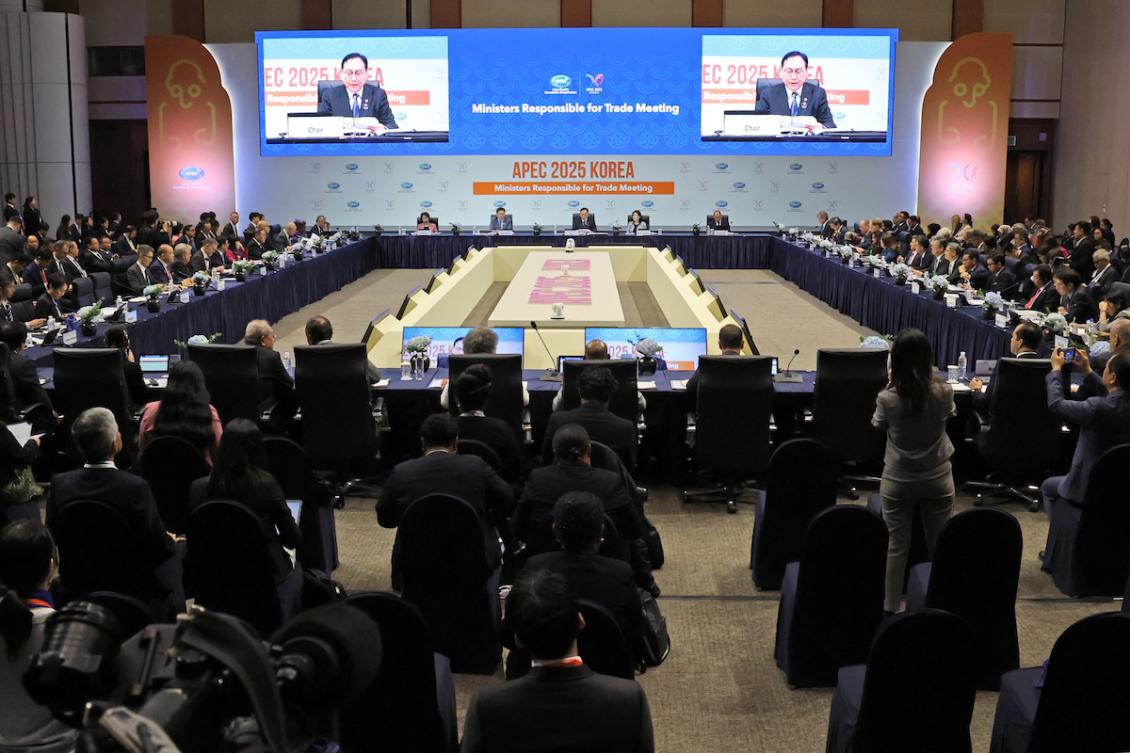South Korean Trade Minister Cheong In-kyo (seen on screens) delivers a speech during the opening ceremony of the Asia-Pacific Economic Cooperation (APEC) 2025 Trade Ministers Meeting at the Jeju International Convention Center in Jeju on May 15, 2025. (FILE/AFP)