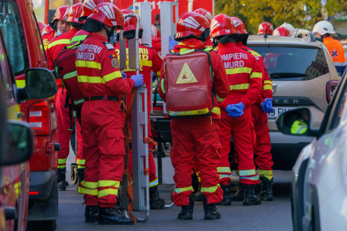 Emergency teams in front of a damaged apartment building after a powerful explosion in a residential block in Bucharest, Romania, Friday, Oct. 17. (AP)