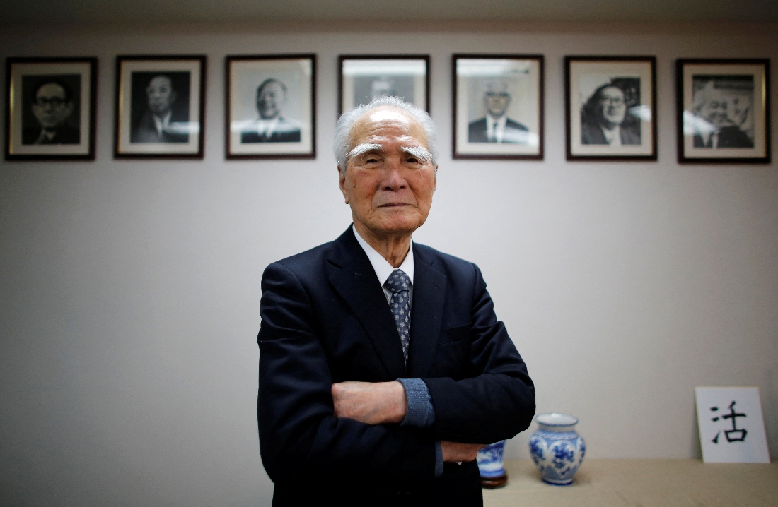 Former Japanese Prime Minister Tomiichi Murayama poses in front of portraits of former leaders of his Social Democratic Party in Tokyo, Japan. (Reuters)