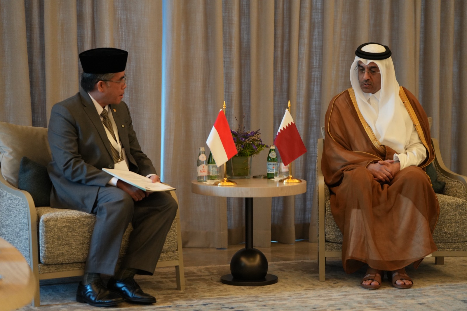 Indonesia’s Manpower Minister Yassierli talks with Qatari Labor Minister Ali bin Samikh Al-Marri in Doha in this photo shared on Oct. 17, 2025. (Indonesian Manpower Ministry)