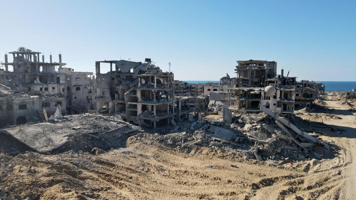 An aerial view shows the Al-Maqussi Towers district, heavily damaged by massive Israeli bombardment over the past two years, in northwestern Gaza City on October 15, 2025, during a US-brokered ceasefire between Israel and Palestinian factions. Defence Minister Israel Katz threatened late on October 15 to resume fighting if Hamas did not honour the terms of a US-backed ceasefire that halted the war in Gaza. (Photo by AFP)