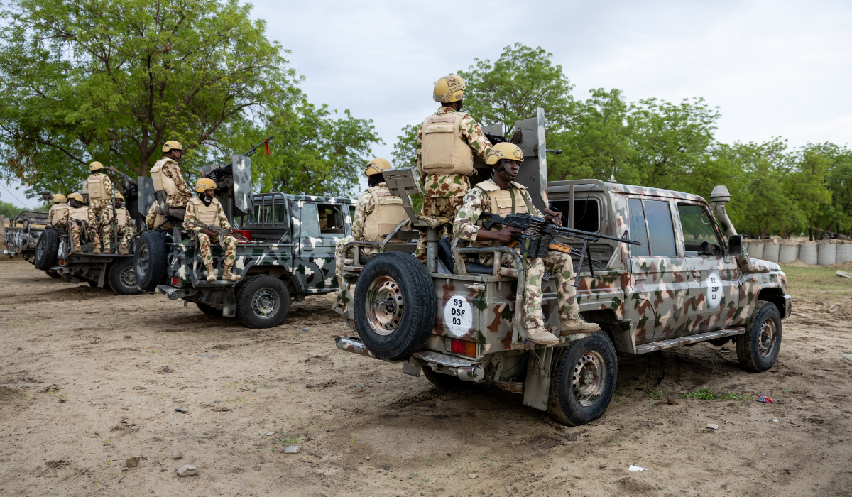 Nigerian soldiers from the Multinational Joint Task Force (MNJTF) sit on parked vehicles during training at the MNJTF military base, Sector 3 Headquarters, in Monguno, Borno state, Nigeria, on July 5, 2025. (AFP)