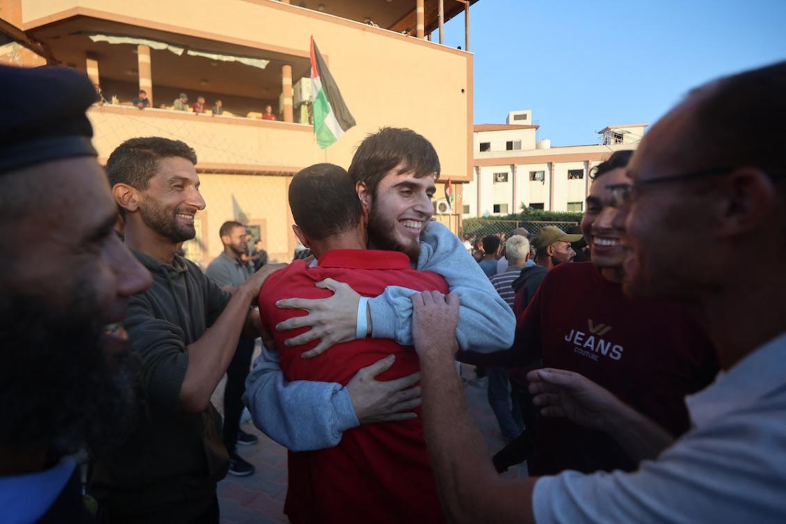 A Palestinian released from Israeli prisons under a Gaza ceasefire and hostage exchange deal with Palestinian factions, is greeted by relatives as he arrives at the Nasser hospital in Khan Yunis in the southern Gaza Strip on October 13, 2025. (FILE/AFP)