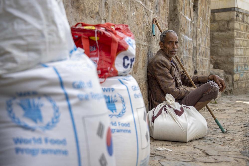The Houthis have launched a long-running crackdown against the UN and other international organizations working in militant-held areas in Yemen. Above, a Yemeni receives aid from the World Food Programme. (AFP file photo)