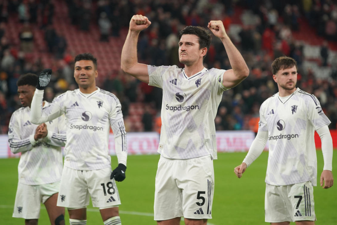 Manchester United’s Harry Maguire greets supporters after winning the Premier League match between Liverpool and Manchester United at Anfield. (AP)