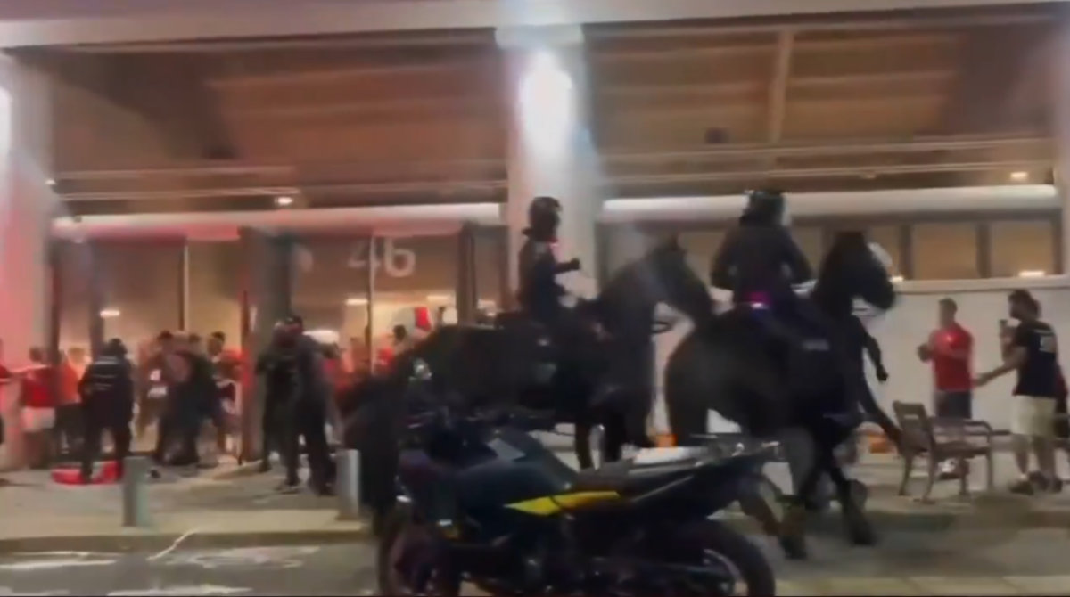A screengrab from a video widely shared on social media shows people running running helter-skelter outwide the commotion outside Tel Aviv's Bloomfield Stadium amid disturbances ahead of Sunday's football derby between Maccabi Tel Aviv and Hapoel Tel Aviv. (X)